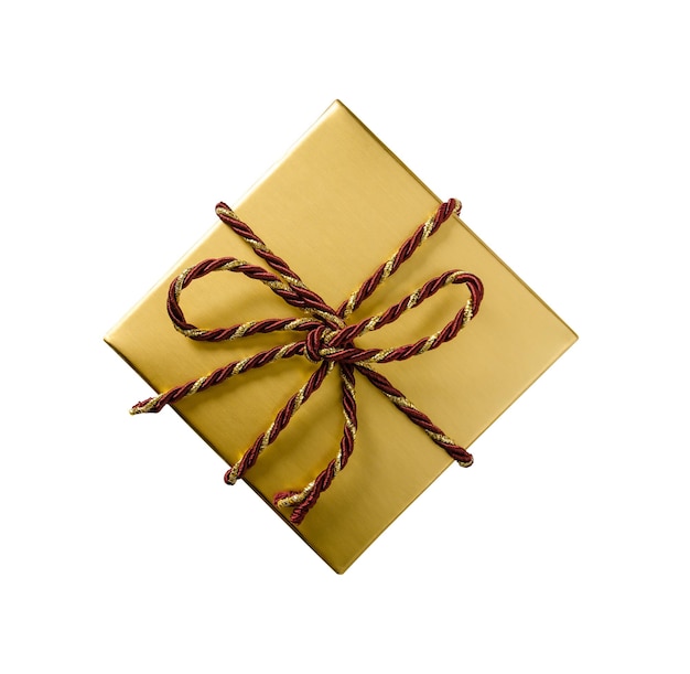 Golden gift box with red and gold rope bow on white background