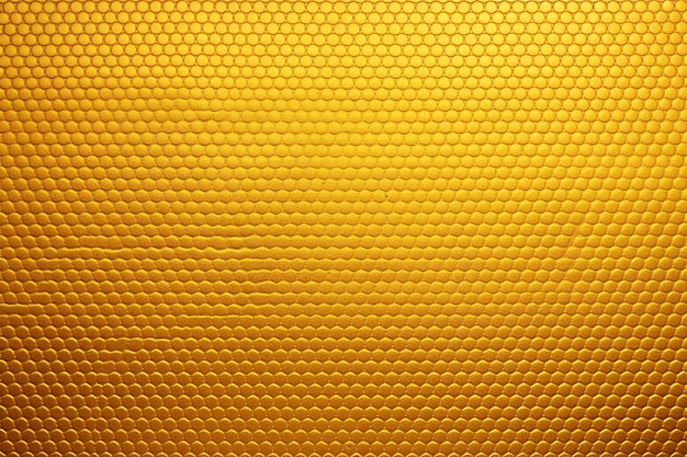 Golden honeycomb background texture with some shades and highlights on it