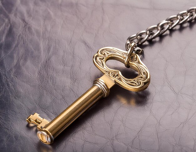 A Golden Key With Chain Attached