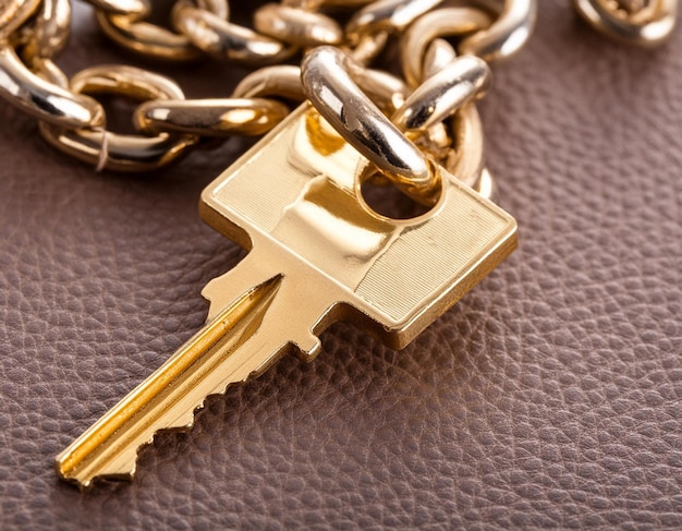 A Golden Key With Chain Attached