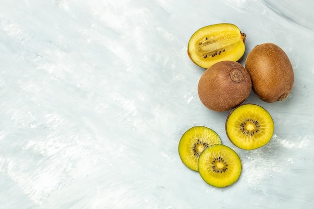 Golden kiwi fruit on a light background banner menu recipe place for text top view