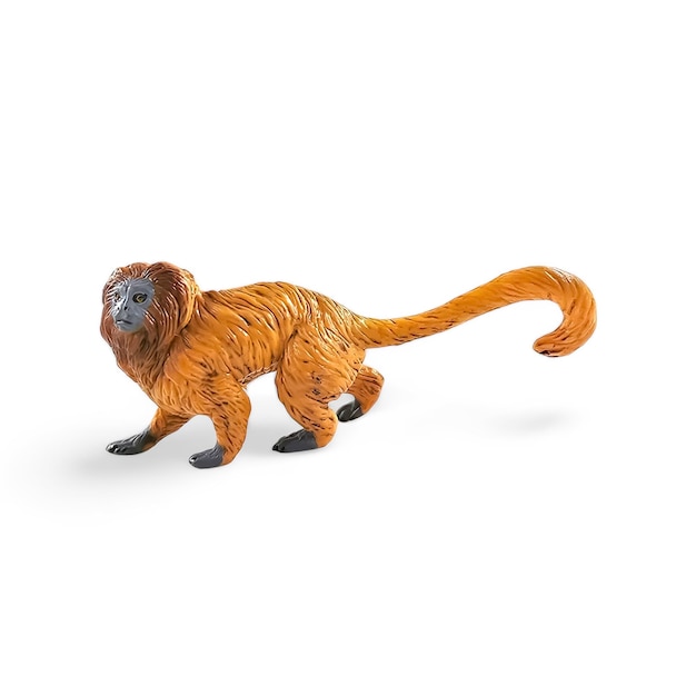 Photo golden lion ape tamarin miniature toy isolated on white