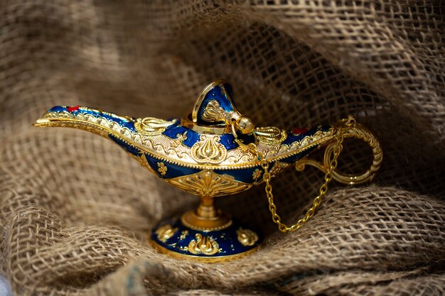 Golden magic genie lamp. lamp of desires from the story of Aladdin with Genie