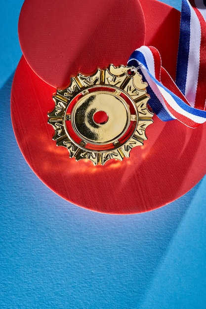 Golden medal on red background