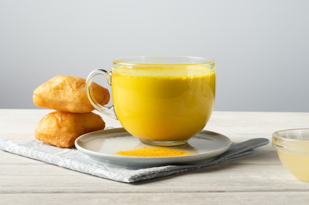 Golden milk with turmeric and honey, a traditional Indian drink