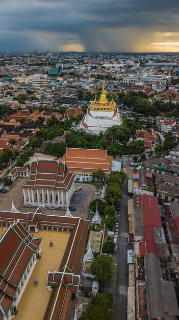 Golden Mountain Wat Saket Ratcha Wora Maha Wihan popular Bangkok tourist attraction Landmarks of bangkok Thailand In the rain before topview