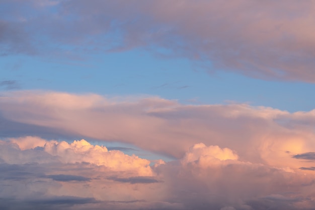 Golden and pink clouds with soft haze on sunset as abstract background