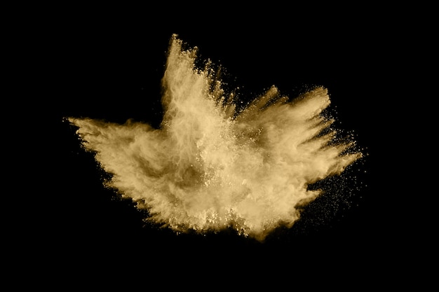 Golden powder explosion on black.  