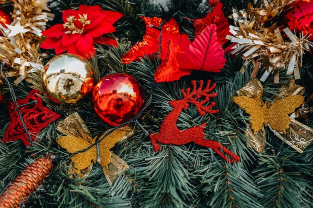 Golden red Christmas decorations and spruce branches Festive mood Beautiful bokeh