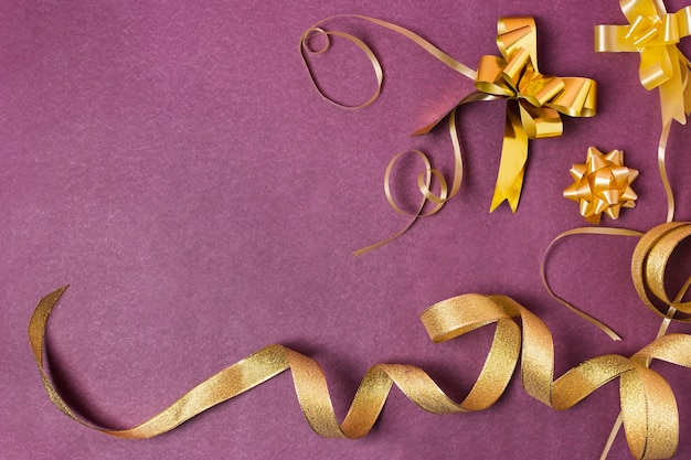 Golden ribbon on purple background