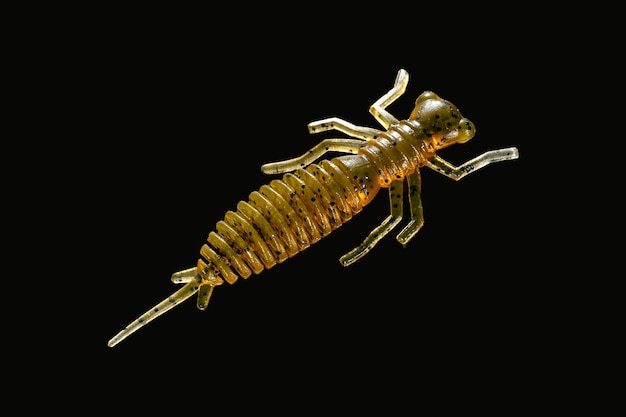 a golden scorpion with a gold body and a black background