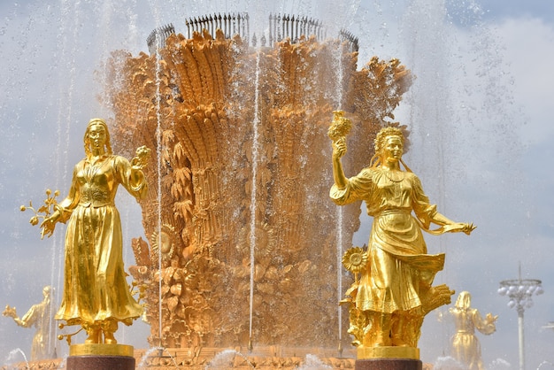 Golden sculpture on the fountain Friendship of Peoples in Park