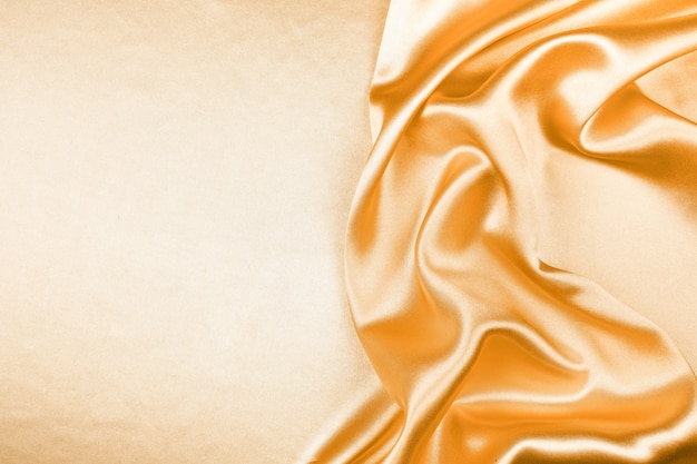 Golden silk texture luxurious satin  abstract background, fabric