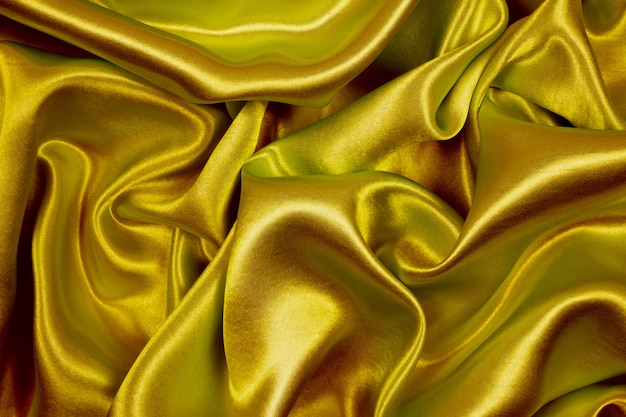 Golden silk texture luxurious satin for abstract background