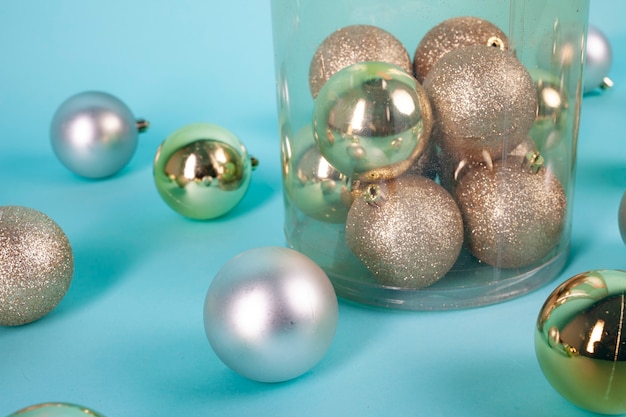 golden and silver christmas spheres on blue background