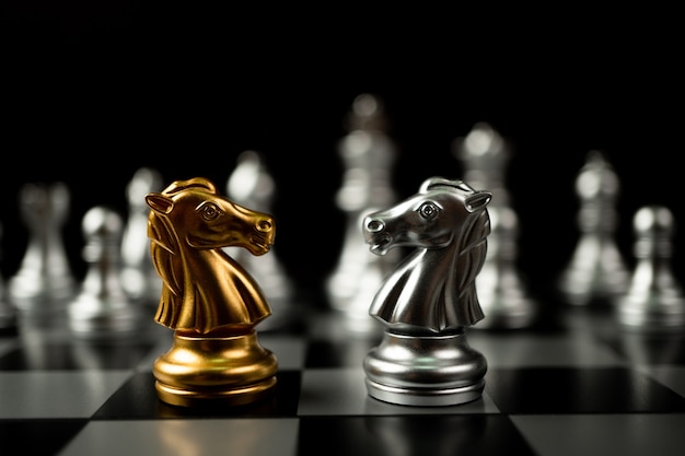 Golden and silver horse chess pieces