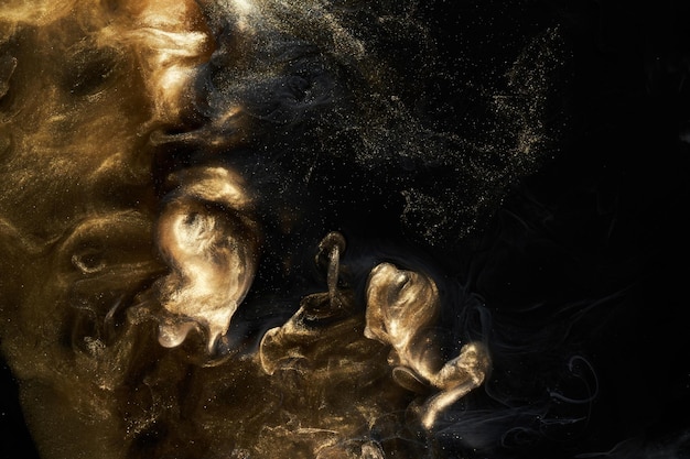 Golden sparkling abstract background luxury black smoke acrylic paint underwater explosion cosmic swirling ink