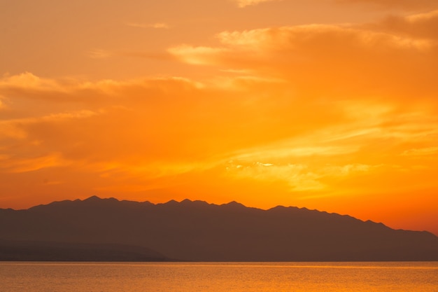 Golden sunset in Crete with clouds. 
Rethymno view