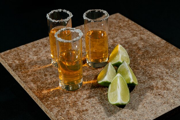 Golden tequila with lemon and salt. Drinks, Liquor