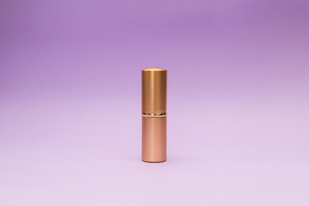 Golden tube on purple background