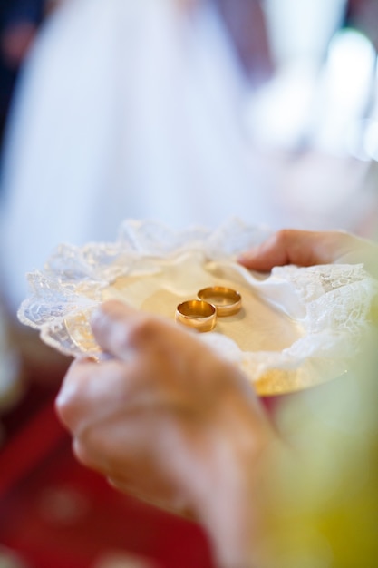 Golden wedding rings for newlyweds on their wedding day