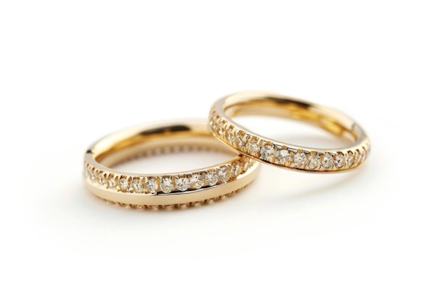 Golden wedding rings on a white background Bride and Groom Rings