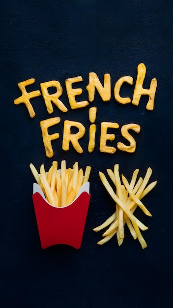 Photo golden yellow french fries font with red container and perfectly arranged fries beside vertical mobi