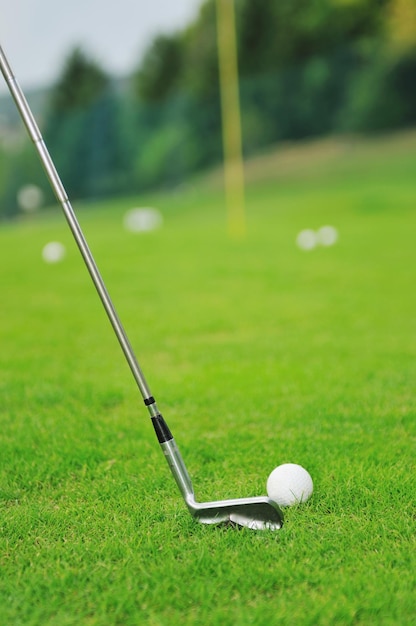 golf ball on sports golf course and hole