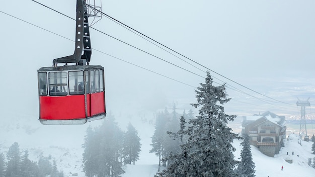 A gondola in the middle of the mountains. Winter travel concept.