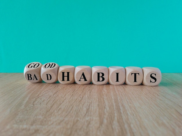 Good or bad habits symbol Turned wooden cubes and changed concept words Old habits to New habits