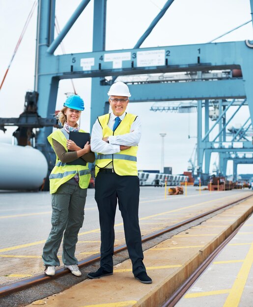 A good boss to work for. Two engineers discussing planning on a site while in the shipyard.