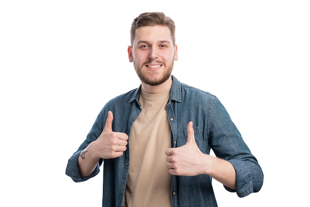 Good looking young guy showing thumbs