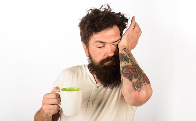 Good morning morning with coffee or milk man with cup of coffee handsome bearded man drinking cup of