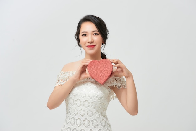 Gorgeous, Asian bride in white luxury dress