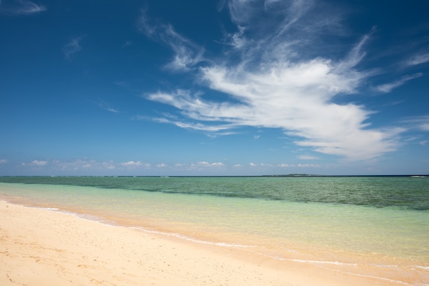 Gorgeous beach, emerald green sea, amazing cumulonimbus cloud formation. Iriomote Island.