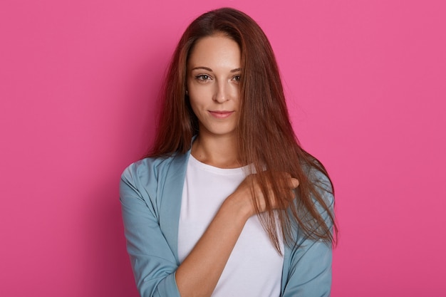 Gorgeous brunette young woman with long glamorous hair