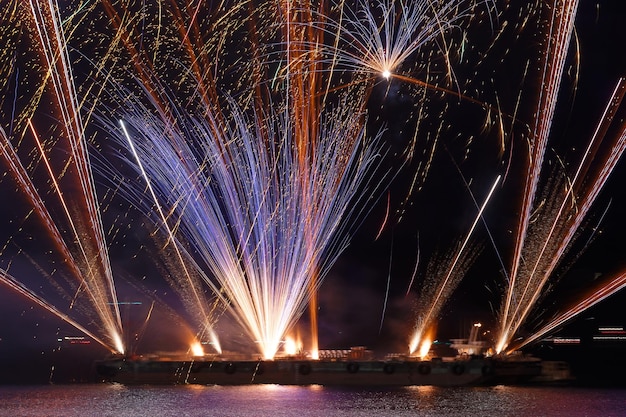 Gorgeous multicolored fireworks display on dark blue night sky