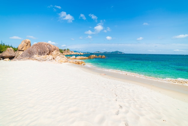 Gorgeous tropical beach turquoise transparent water unique rock boulders Vietnam