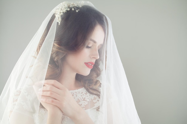 Gorgeous woman bride in romantic veil