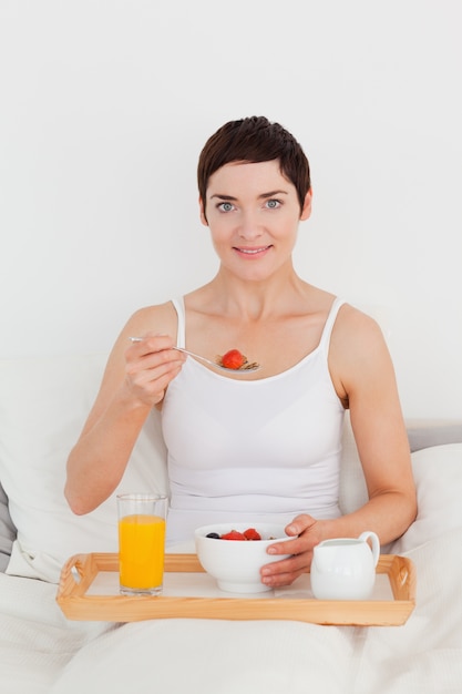 Gorgeous woman having breakfast