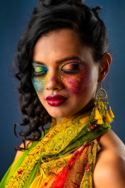 A gorgeous Young model beautiful woman or girl with perfect art creative makeup like a butterfly