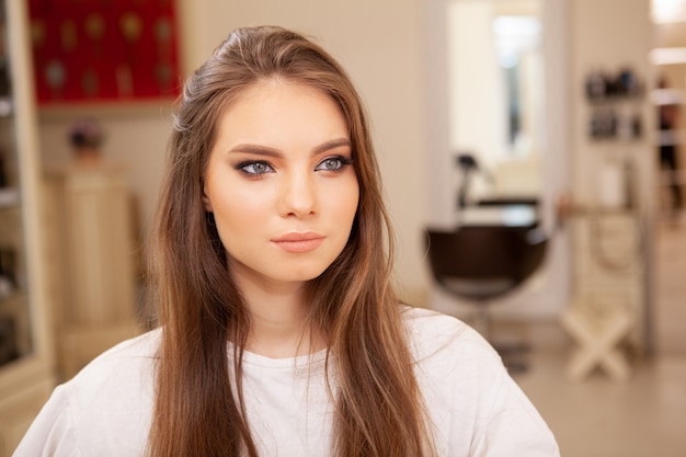 Gorgeous young woman with professional make-up