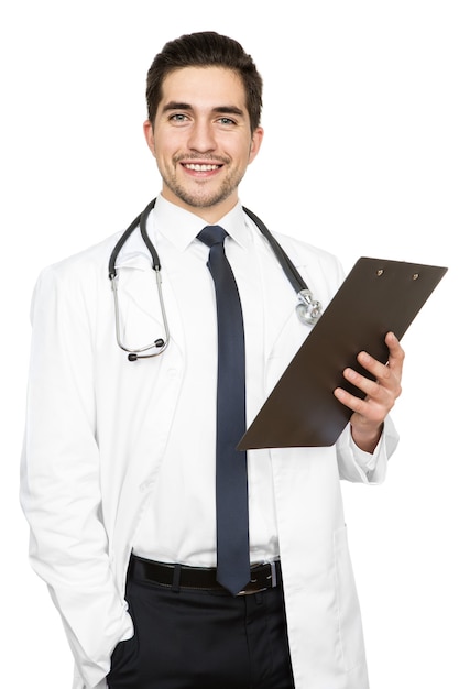 Got some health news. Vertical studio shot of a handsome doctor holding a clipboard isolated on white