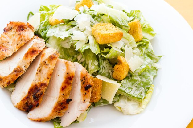 Gourmet caesar salad with grilled chicken croutons.