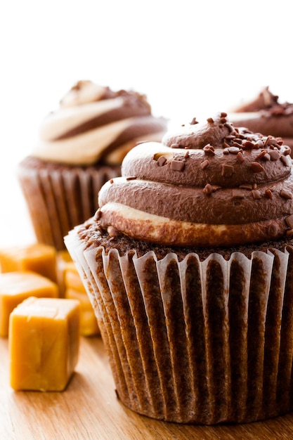 Gourmet chocolate caramel swirl cupcake with chocolate sprikles.