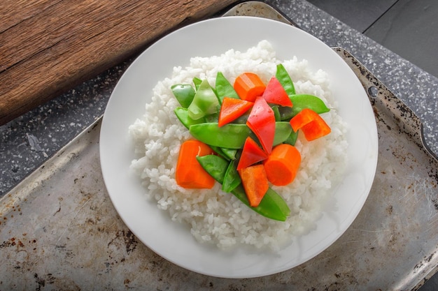 Gourmet Delight CloseUp of Steamed Rice with Cooked Vegetables on Top Captured in 4K Resolution