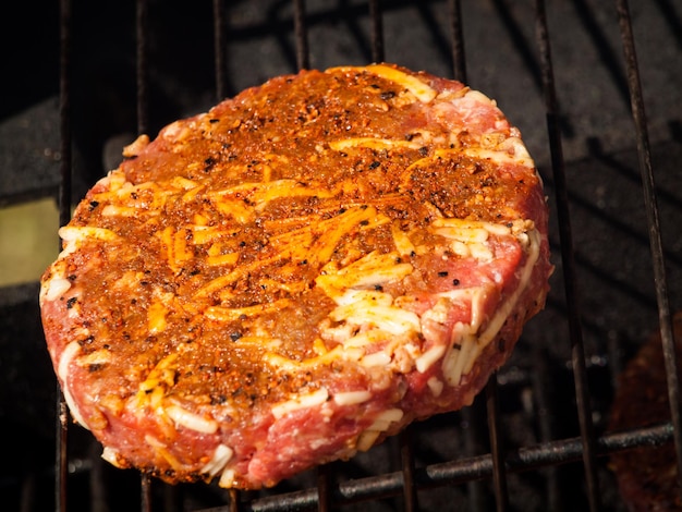 Gourmet hamburger parries on the grill.