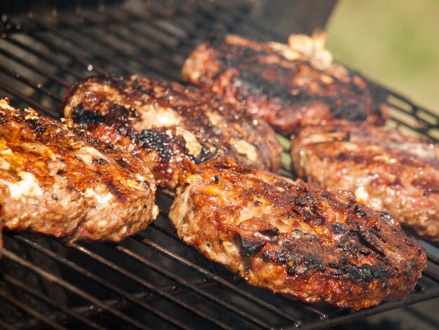 Gourmet hamburger parries on the grill.