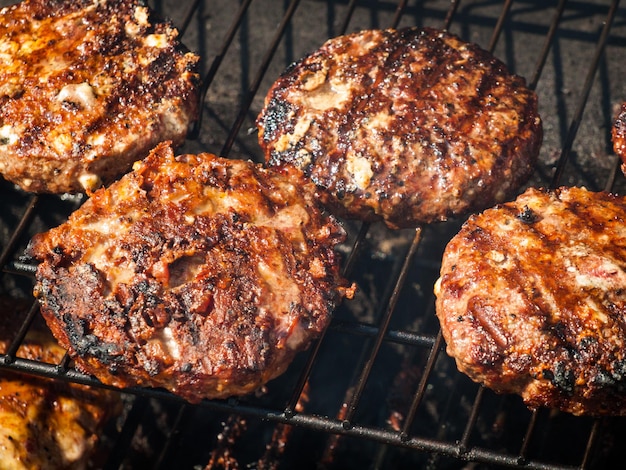 Gourmet hamburger parries on the grill.