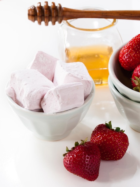 Gourmet strawberry marshmallows on white background.